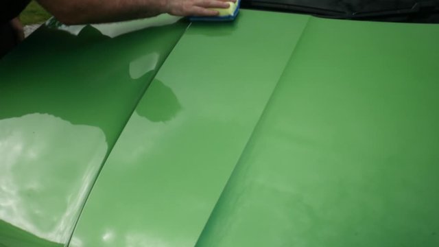 Applying ceramic sealant to a green car