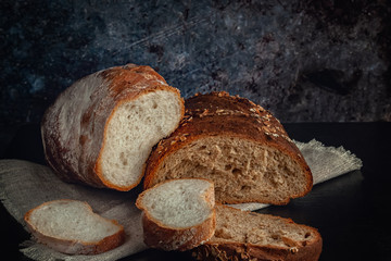 Fresh bread with bran, seeds and oatmeal on the table