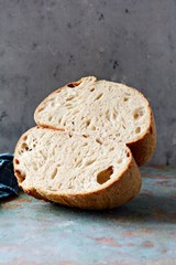 Homemade Freshly Baked Country Bread  made from wheat and whole grain flour on a gray background. French Freshly baked bread. 