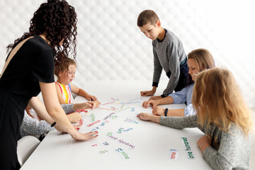 English teacher with children in the classroom.