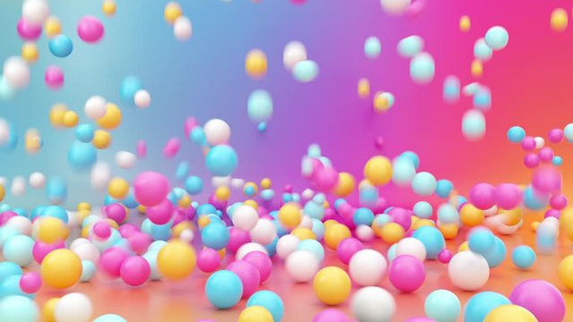 3d rendering of assorted colorful balls falling down, bouncing and jumping over vibrant gradient background, interactive particles motion. Animated gravity effect. Abstract minimal design, fun concept