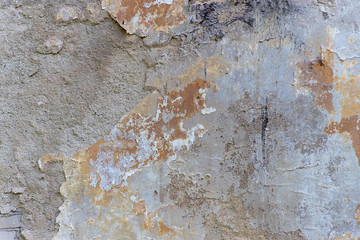 Grunge destroyed concrete wall on an old building. Natural destroyed stone surface.