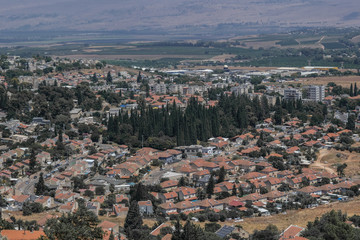 Town of Rosh Pina and Hula Valley with the Golan Heights in the background as seen from a lookout point in Rosh Pina, Upper Galilee, Northern Israel, Israel.