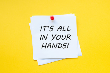 It's all in your hands. Motivational slogan on white sticker with yellow background. Motivational Business.