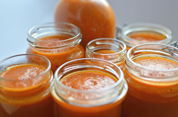 Selective focus image of jars filled with chili sauce