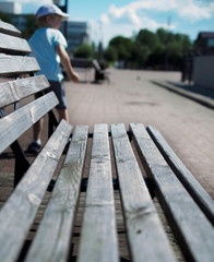 Obraz na płótnie Canvas bench on the embankment on a sunny summer day.