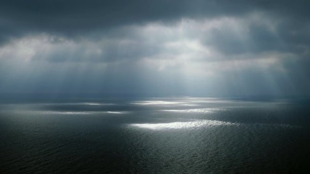 Scenic seascape. Beautiful rays of sun breaking through the clouds over The Black sea. 4K