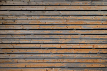 Fototapeta premium Texture of the wall covered with old wooden slats.
