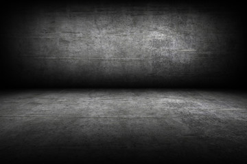 Grunge interior room with concrete wall and floor. Empty concrete space
