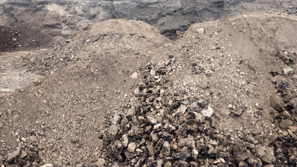 Large piles of old asphalt in the after road repair.