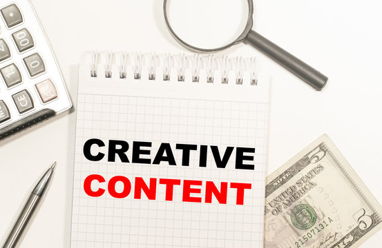 text BE CREATIVE CONTENT written on notepad with calculator, pensil, magnifier and dollars. Business concept