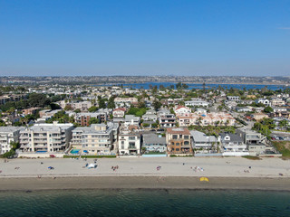 Aerial view of Mission Bay and beaches in San Diego, California. USA. Community built on a sandbar with villas and recreational Mission Bay Park. Californian beach-lifestyle.