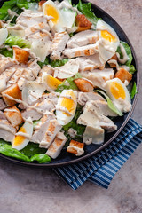 Grilled chicken caesar salad with crunchy croutons