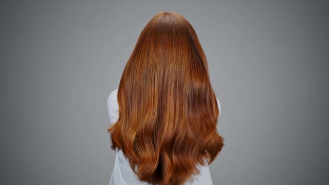 Gorgeous falling red hair in slow motion.