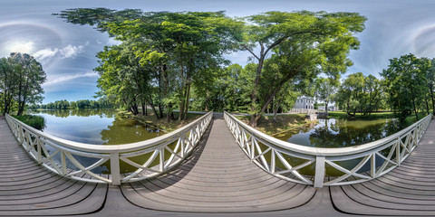 full seamless spherical hdri panorama 360 degrees  angle view on wooden bridge over small river in forest in equirectangular projection, VR AR content.