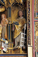 San Lorenzo; particolare dell'altare scolpito di Hans Klocker nella chiesa di Santo Stefano a Pinzano (Bolzano)