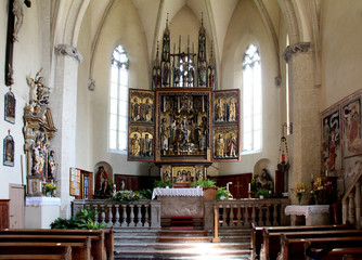 Fototapeta na wymiar l'altare scolpito di Hans Klocker nella chiesa di Santo Stefano a Pinzano (Bolzano)