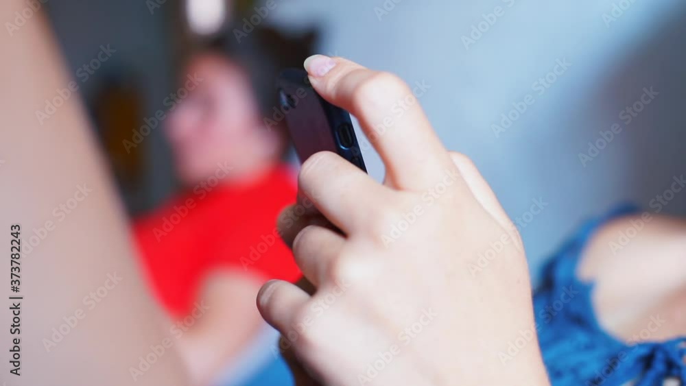 Poster close-up of a woman using the phone. remote communication in self-isolation. sending a text message 