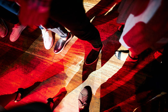 Feet On The Dance Floor In A Nightclub In The Spotlight