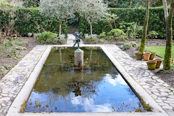 Rectangular ornamental pond in an English country garden
