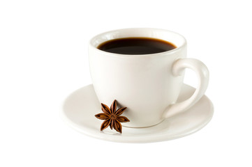 Cup of aromatic black coffee in a white cup isolated on a white background with star anise.