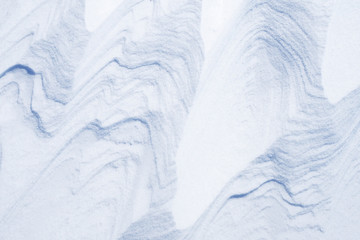 The background of snow. Texture of snow cover after a heavy snowstorm. Winter.
