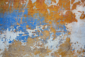 Texture of old wall with shabby orange and blue paint. Background