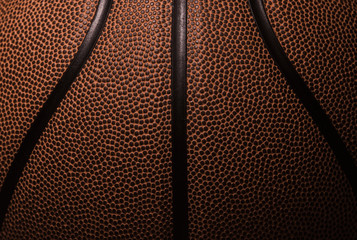 Fototapeta premium Closeup detail of basketball ball texture background. Team sport concept.