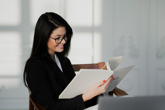 Business Woman Reading A Document