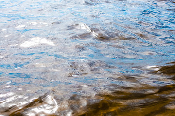 Pattern of waves in water of Ladoga lake in Karelia