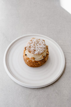 Isolate paris brest french pastry cake concfectioner on a ceramic plate