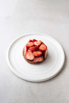 Isolate strawberry tart on a ceramic plate 