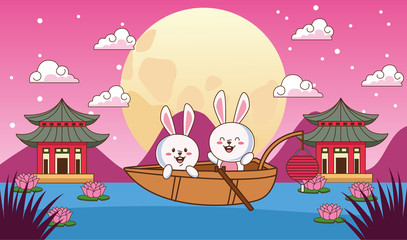 mid autumn celebration card with little rabbits couple in boat floating in the lake