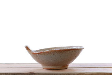 Japanese bowl on wooden floor isolated on white.