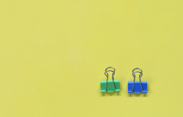 Clamp paper clip on yellow art paper.