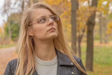 Beautiful young woman portrait in Autumn fall