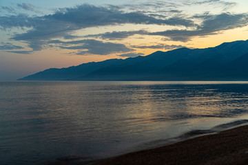 Scenic baikal lake in summer, pastel blue dawn