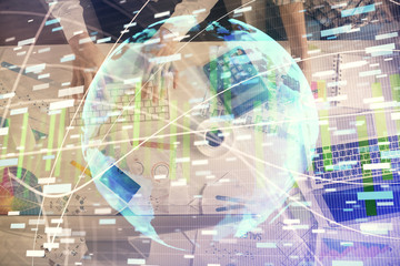 Double exposure of man and woman working together and business theme hologram drawing. Computer...