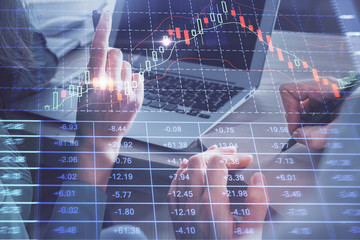 Double exposure of man and woman working together and forex chart hologram. Business concept. Computer background.