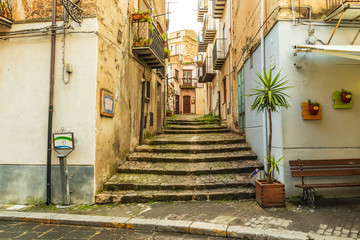 Italy, Sicily, Palermo Province, Castelbuono. Stairs on a narrow side street in the town of...
