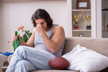 Male ex-champion american football player suffering from alcohol