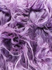Obraz premium Close up of a purple dyed sheepskin rug as a background