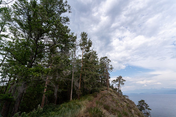 Irkutsk region, Olkhon, Baikal lake, July 2020: dramatic landscape before the storm, from down to up view of the sky