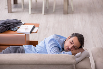 Tired businessman employee working from home