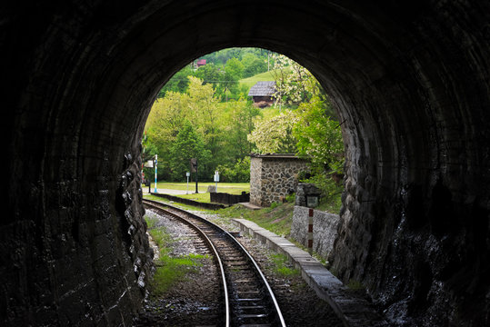 Narrow-gauge heritage railway track for the Sargan Eight train running through a tunnel, Mokra Gora, Serbia