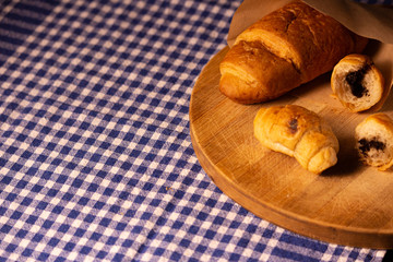 Obraz na płótnie Canvas croissant on wood