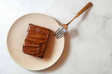 Slice of chocolate cake with chocolate frosting