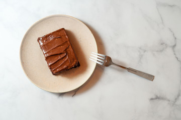 Slice of chocolate cake with chocolate frosting