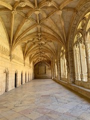 Fototapeta premium Beautiful reticulated vaulting on courtyard or cloisters of Hieronymites Monastery, Mosteiro dos Jeronimos, famous Lisbon landmark in Belem district and Unesco Heritage, PortugalPortugal