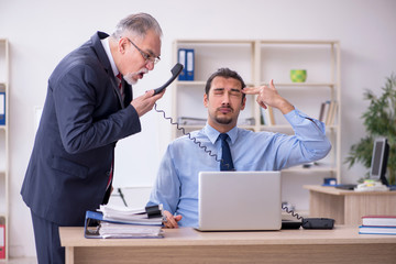 Obraz premium Two employees in the office